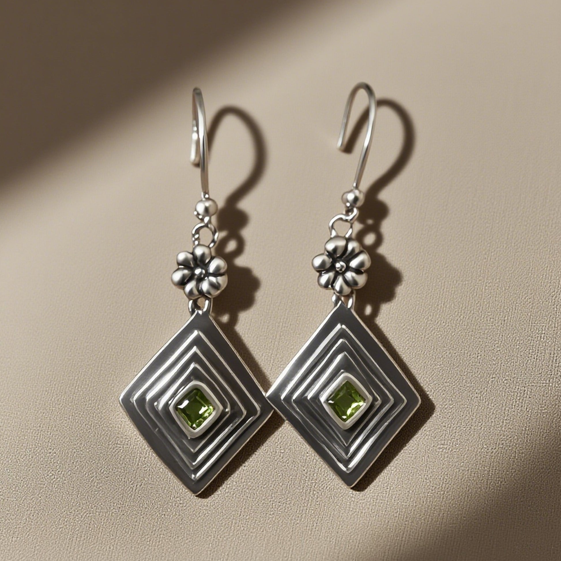 Elegant Silver Peridot Drop Earrings with Floral Design
