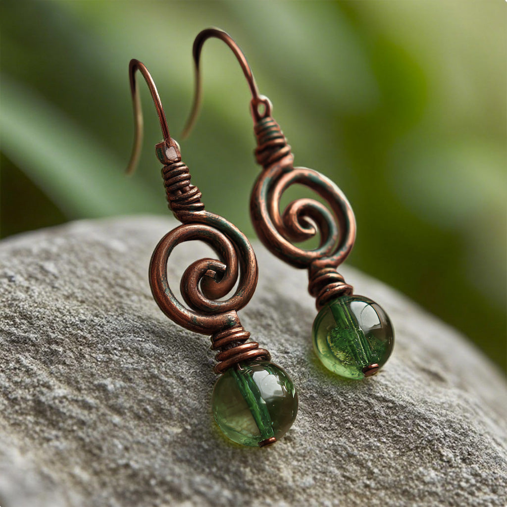 Handcrafted Copper Spiral Earrings with Green Glass Beads